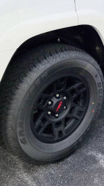 Close-up of the black wheel and tire of a 2023 Toyota 4Runner TRD Off-Road in excellent condition