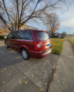 2014 Chrysler Town & Country Mini Van in good condition parked in a residential area.