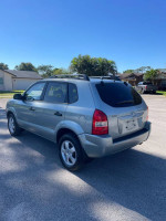 2008 Hyundai Tucson in excellent condition, featuring new tires and a clean title, parked outdoors.