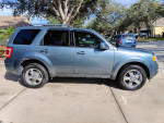 2011 Ford Escape Limited FWD in blue with alloy wheels parked outside