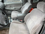 Interior view of a 2001 Toyota Tacoma PreRunner RWD with grey upholstery and spacious seating.