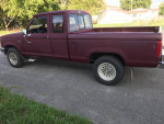 Maroon Ford Ranger XLT truck, great condition, with noticeable features like new brakes and four-wheel drive.