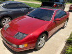 1990 Nissan 300ZX in red parked outside, featuring a sleek design and new audio system.