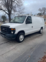 2008 Ford E-150 cargo van in white, showcasing exterior features and in good condition, available for $5400.