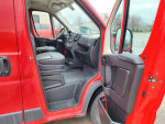 Interior view of a red 2015 Ram 2500 Power Wagon highlighting front seats and dashboard.