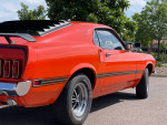 1969 Ford Mustang Mach 1 in Calypso Coral color with sleek design and classic features