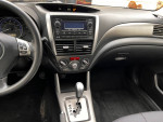Interior view of a 2011 Subaru Forester 2.5X AWD featuring dashboard and controls.