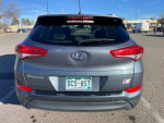 Rear view of a 2017 Hyundai Tucson SUV with low mileage and minor scratches for sale.