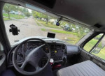 Interior view of a 2009 Freightliner M2 box truck with dashboard and steering wheel.