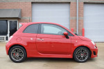 2015 FIAT 500 Abarth in red with original rims, showcasing its sporty design and manual transmission