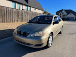 2007 Toyota Corolla SE in tan color parked on street, one owner, well maintained with clean interior