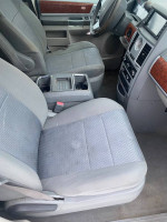 Interior view of a 2009 Chrysler Town & Country showing front seats and dashboard features.