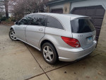 2010 Mercedes-Benz R 350 4MATIC parked, featuring Iridium Silver exterior and black leather interior.