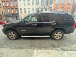 2005 Ford Explorer XLT 4WD parked on the street, featured for sale in Brooklyn with a clean title.