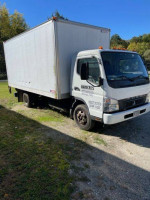 2010 Mitsubishi Fuso FE145 box truck with E-track, new tires, and lift gate for sale, near 183k miles.