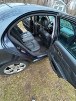 Interior view of a Mercedes-Benz with leather seats and spacious layout, ideal for comfort and driving experience.