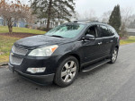 2009 Chevrolet Traverse LTZ FWD with leather interior and sunroof parked on a residential street.