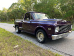 Modified 1971 Chevrolet C10 Shortbed Stepside pickup truck on the roadside in purple color.