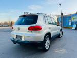 2015 Volkswagen Tiguan SE 4Motion AWD in silver, showcasing its sleek rear design and pristine condition.