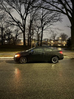 2012 Honda Civic LX Coupe parked in the rain, showcasing its clean design and recent maintenance updates.