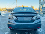 Rear view of a 2013 Honda Civic Hybrid with a clean title and low mileage, parked in a clear area.