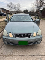 Front view of a 2003 Lexus GS 300 RWD with clean headlights and open doors, ready for a test drive.