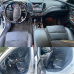 Interior of a 2016 Chevrolet Impala LT showing black leather and suede seats, dashboard, and controls.