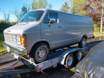 Electric Dodge B300 van with GoCell Batteries displayed on a trailer in Illinois