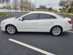 White 2011 Volkswagen CC with leather interior and low mileage parked outdoors.