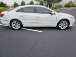 2011 Volkswagen CC in white with low miles, featuring a sleek design and stylish alloy wheels.