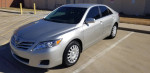 2010 Toyota Camry in silver color parked, featuring 88,000 miles, clean exterior, and in excellent condition.