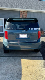 2010 Scion xB with a salvaged title, showing rear view and stickers, in good mechanical condition