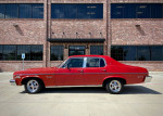 1973 Chevrolet Nova Custom Sedan in red, showcasing classic design and ready for driving or restoration.