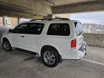 2011 Nissan Armada 4x4 SUV in parking garage, showcasing its spacious design and luxury features.