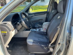Interior view of a 2009 Hyundai Santa Fe GLS with clean seats and dashboard, showing great condition.