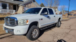 2007 Dodge Ram 3500 Mega Cab 4x4 truck with chrome grille parked in Colorado Springs