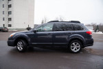 2013 Subaru Outback parked, showcasing its sleek design and new tires, well-maintained with extensive service records.