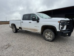 2021 Chevrolet Silverado 2500HD Work Truck 4WD with Ranch Hand bumper and B&W hitch on gravel terrain.