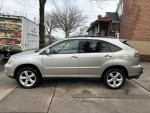 Side view of a 2008 Lexus RX 350 SUV in silver with clean exterior and no visible damage.