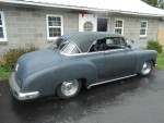 1950 Chevrolet 2-door hardtop, featuring a sleek design and classic styling in gray color parked outside.