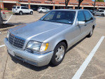 1999 Mercedes Benz S420 parked, featuring new maintenance parts including tires and battery.