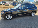 2015 BMW X1 AWD in excellent condition, featuring power amenities, heated seats, and a sunroof.