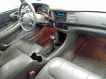 Interior view of a 1999 Chevrolet Blazer showing dashboard and seats, showcasing vehicle condition.