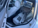 Interior view of a 2007 Jeep Grand Cherokee showing leather seats and door details, available for auction.