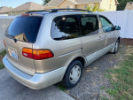 2000 Toyota Sienna XLE FWD in silver, showing the rear side with clean title and no underbody rust.