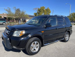 2006 Honda Pilot EX FWD SUV parked, featuring clean exterior, leather seats, and sunroof.