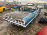 1963 Chevrolet Impala Convertible showcasing rear view, minor rust, and restoration potential.