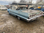 1963 Chevrolet Impala Convertible with a solid body and minor rust parked in Modesto, California.