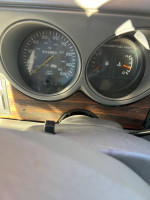 Dashboard view of a 1997 Dodge 3500 van showing speedometer and fuel gauge with 156,453 miles.