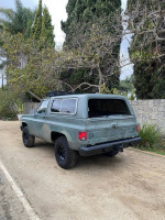 1984 Chevrolet K5 Blazer with a diesel engine parked outdoors, showcasing its rugged design and clean tires.